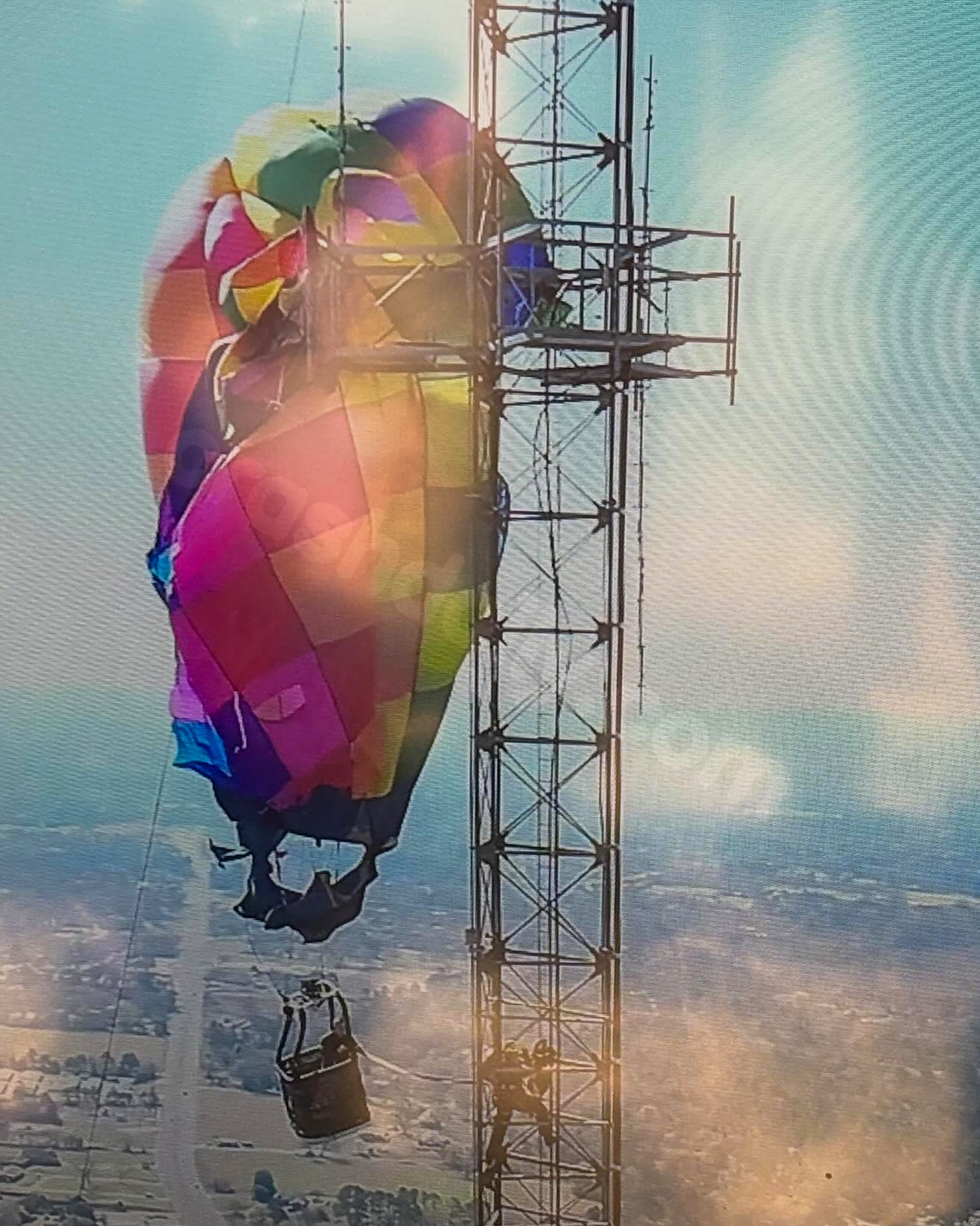 Two passengers rescued after hot air balloon crash into Texas cell tower leaves them dangling 920 feet up