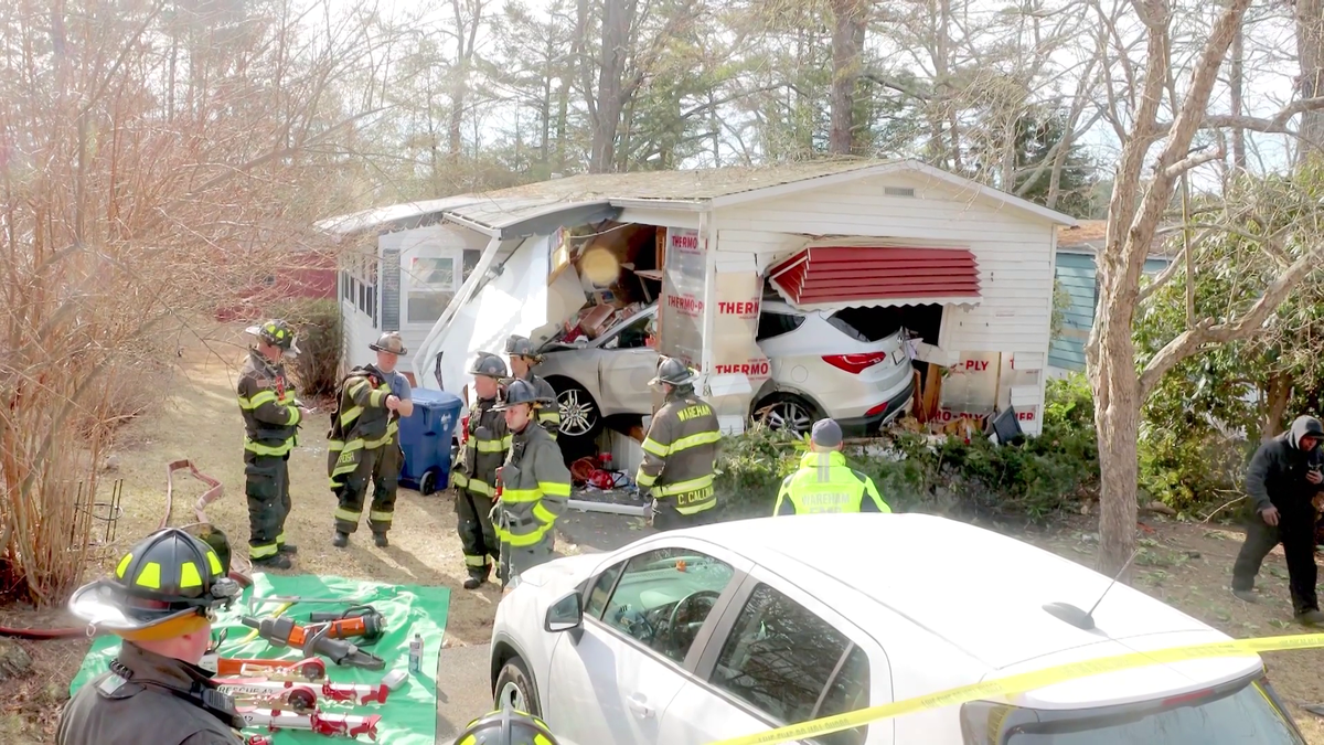 Car crashes through mobile home in Mass. town
