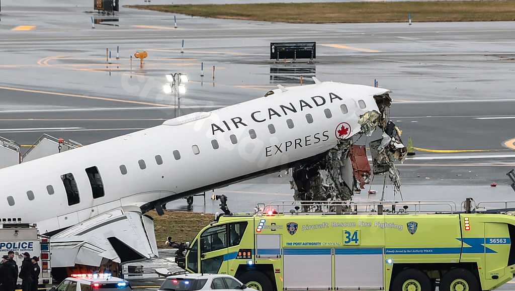 Two pilots killed after jet collides with firetruck at New York's LaGuardia Airport