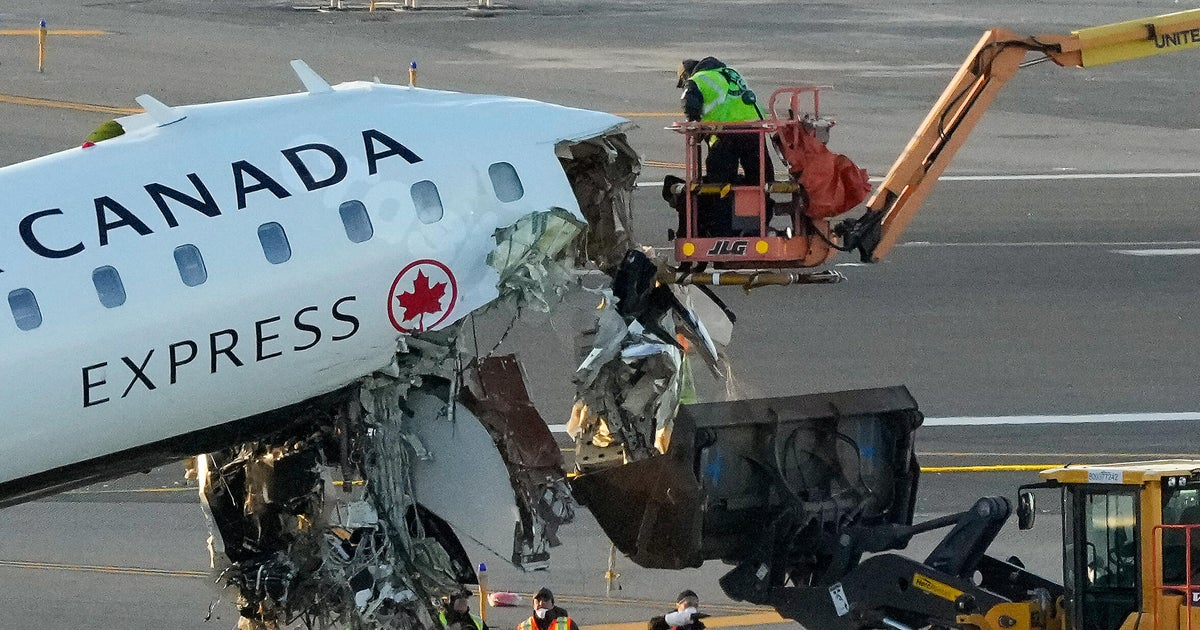 Pilots killed in LaGuardia runway crash being transported to Canada