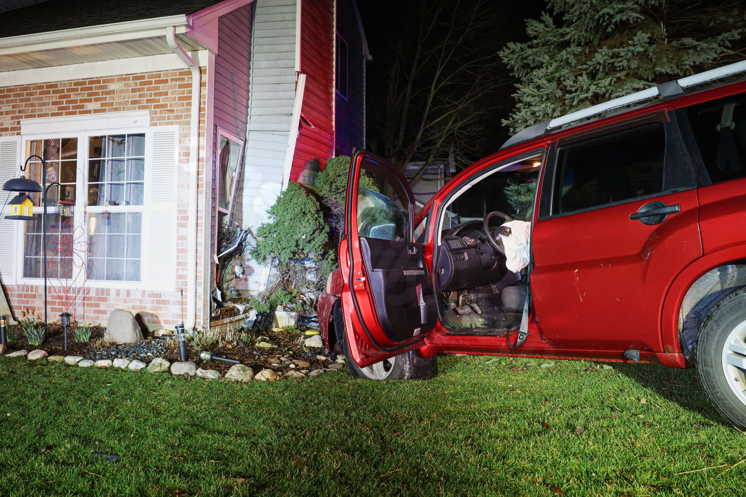 Car crashes into suburban Chicago home and narrowly misses resident, officials say