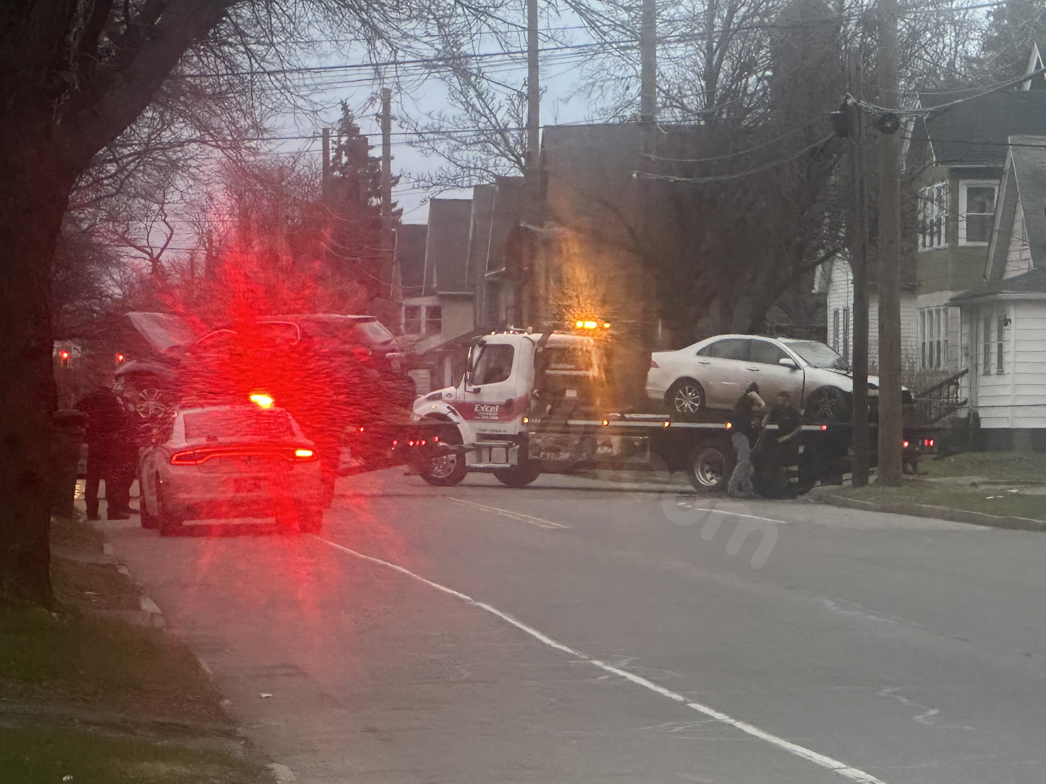 Three hurt after two-car crash sends vehicle into porch on Norton Street