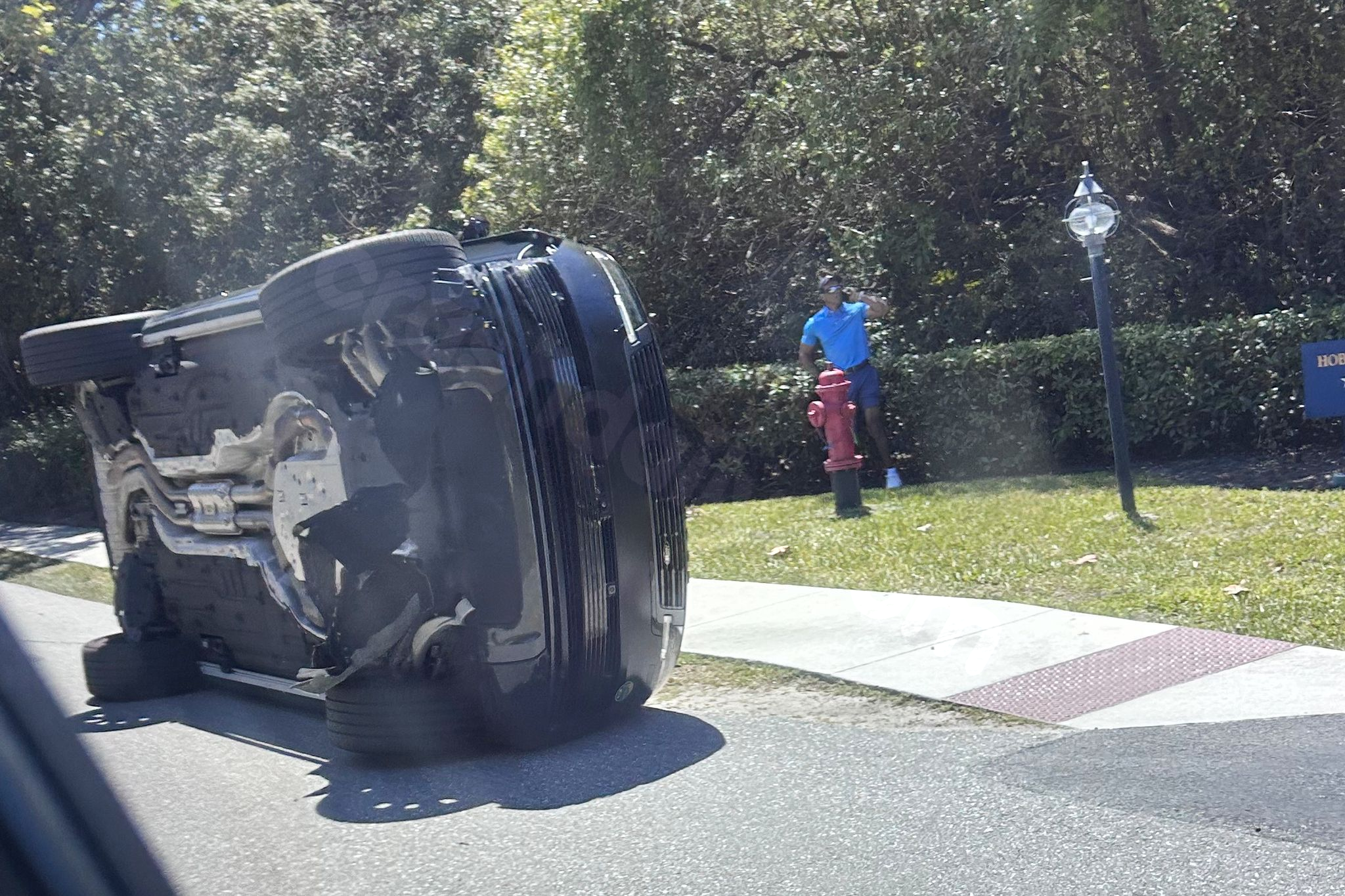Bodycam shows a stunned Tiger Woods handcuffed after a Florida rollover crash