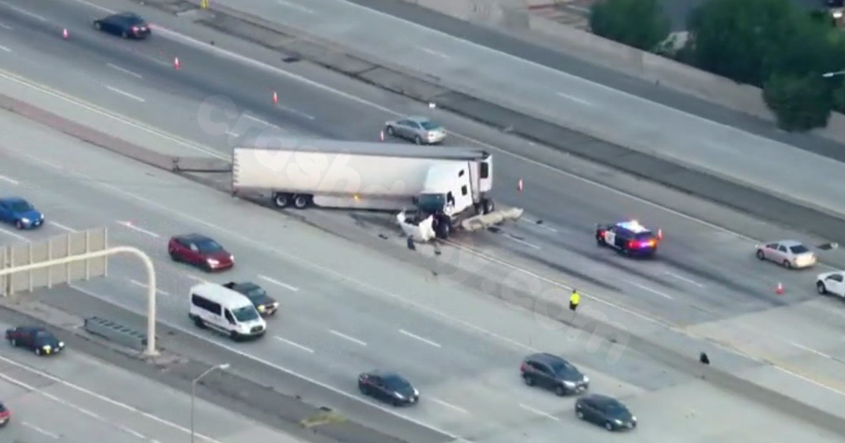 Semi truck crashes through center divider of 118 and 405 freeway transition in Granada Hills