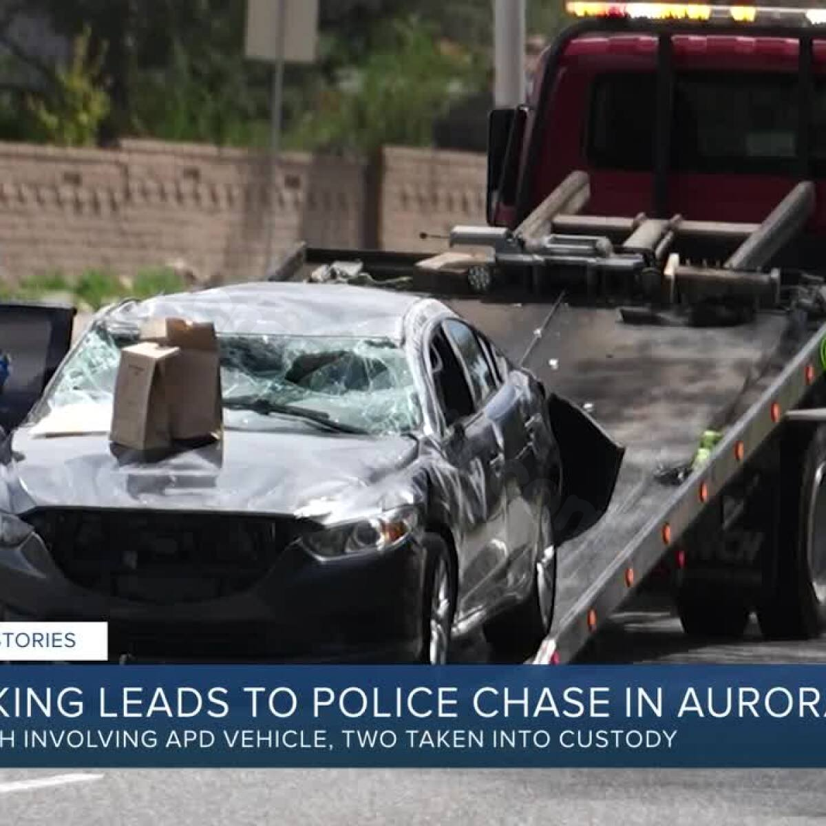 Carjacking ends in multi-vehicle crash in south Aurora; APD officer injured, 2 suspects in custody, police say