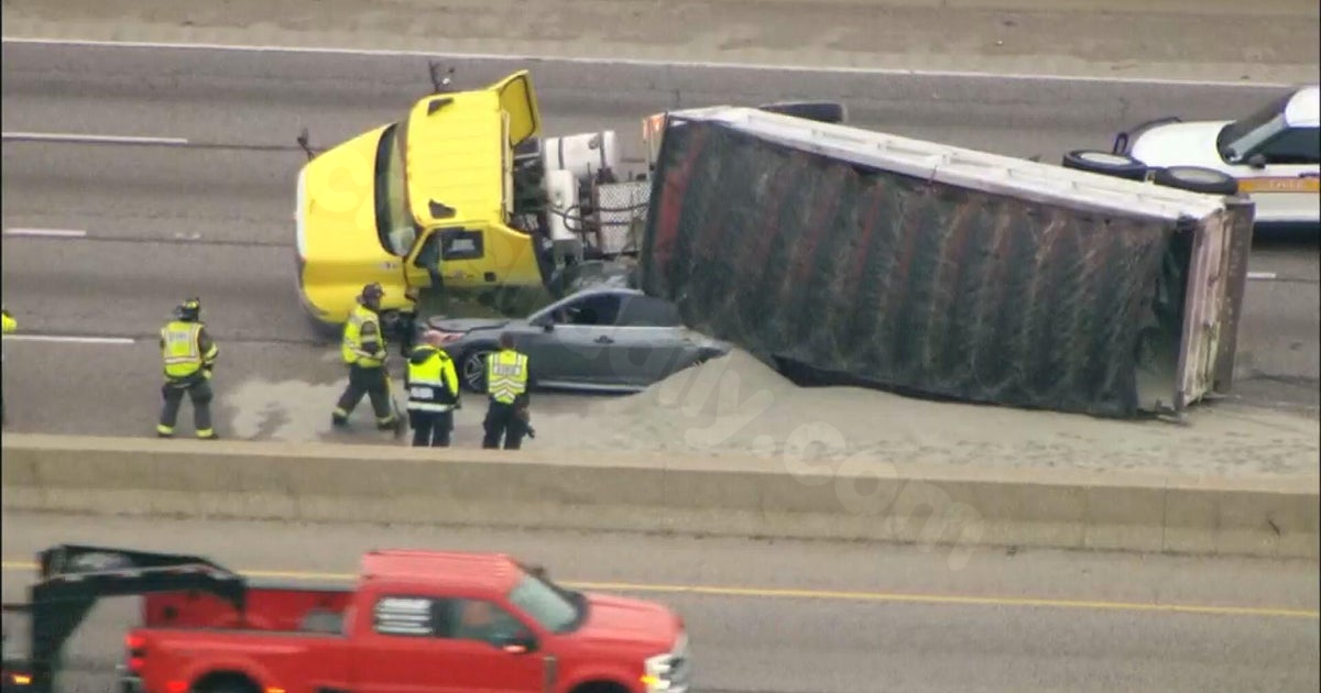 Truck flips over, buries car, spills gravel on Eisenhower Expressway in Chicago's west suburbs
