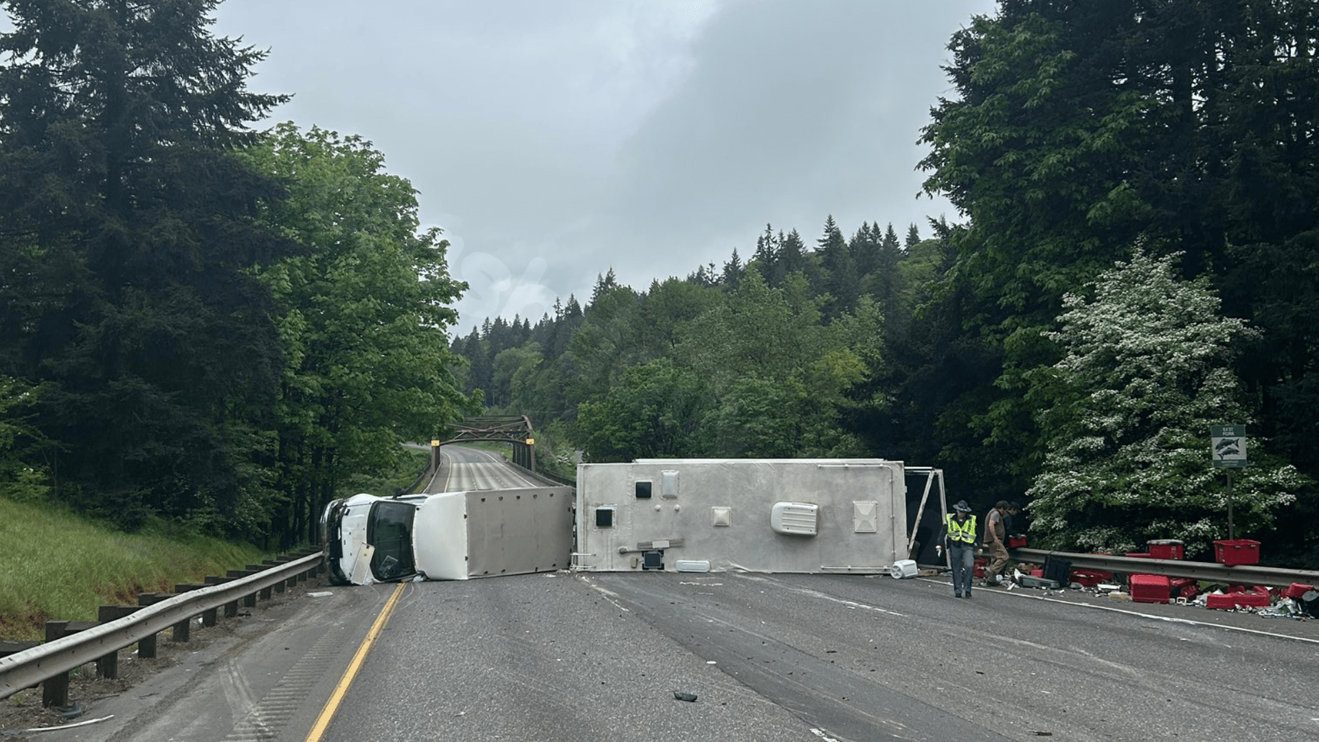 I-5 traffic stalled after toy hauler crashes onto side near East Fork Bridge