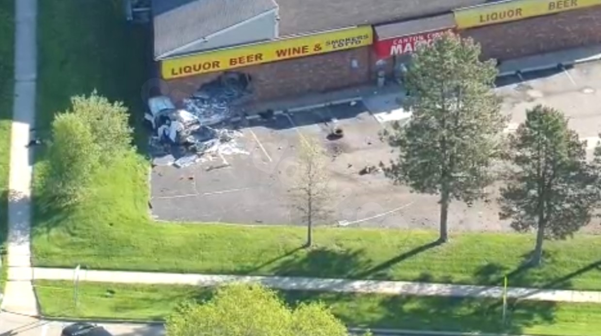 Driver killed after crashing into Canton market building