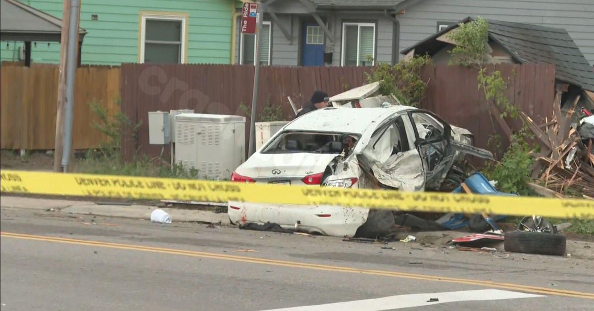 Denver police investigate car crash that damaged home, fence, yard
