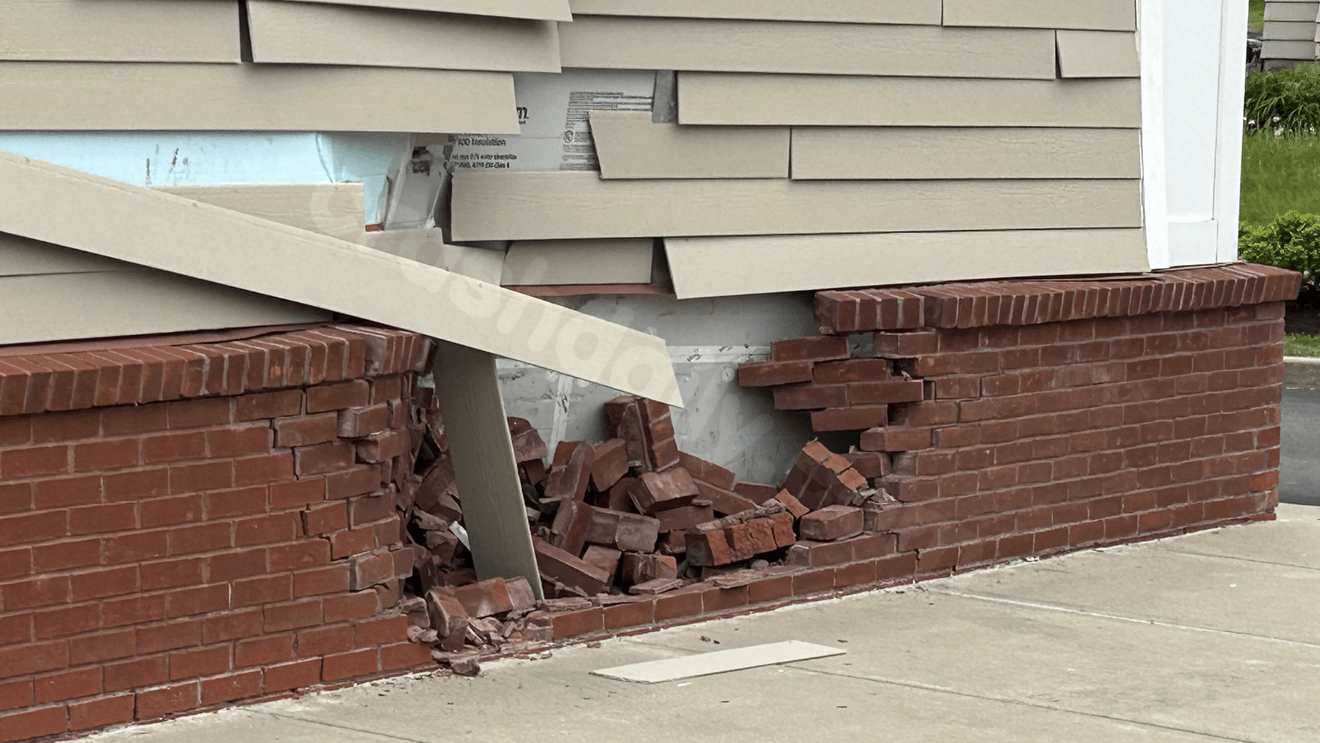 Car crashes into CVS wall