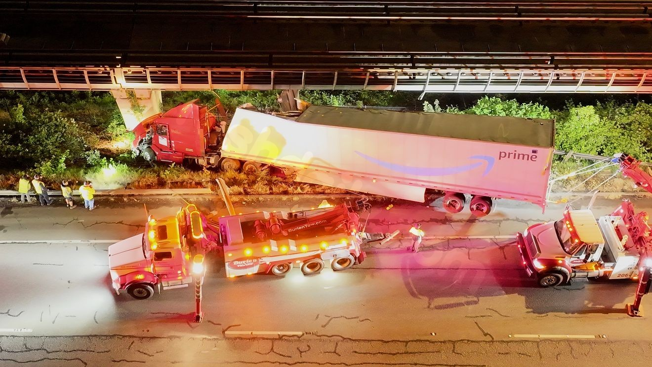 Amazon semi-truck crashes off SR 599 in Tukwila, hits light rail tracks above