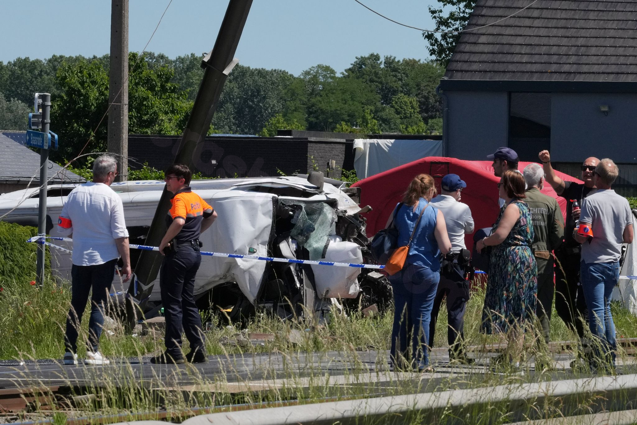 Several hurt in a crash between a train and a minibus, Belgian police say