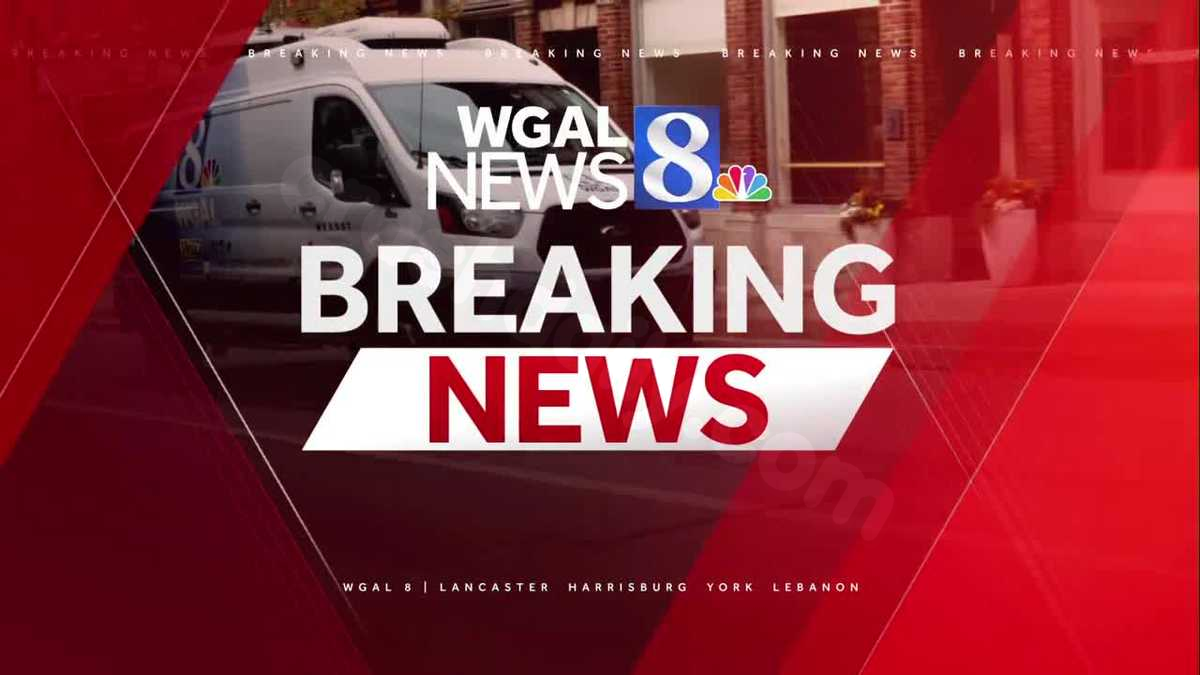 Emergency crews on scene of a car crash into a home
