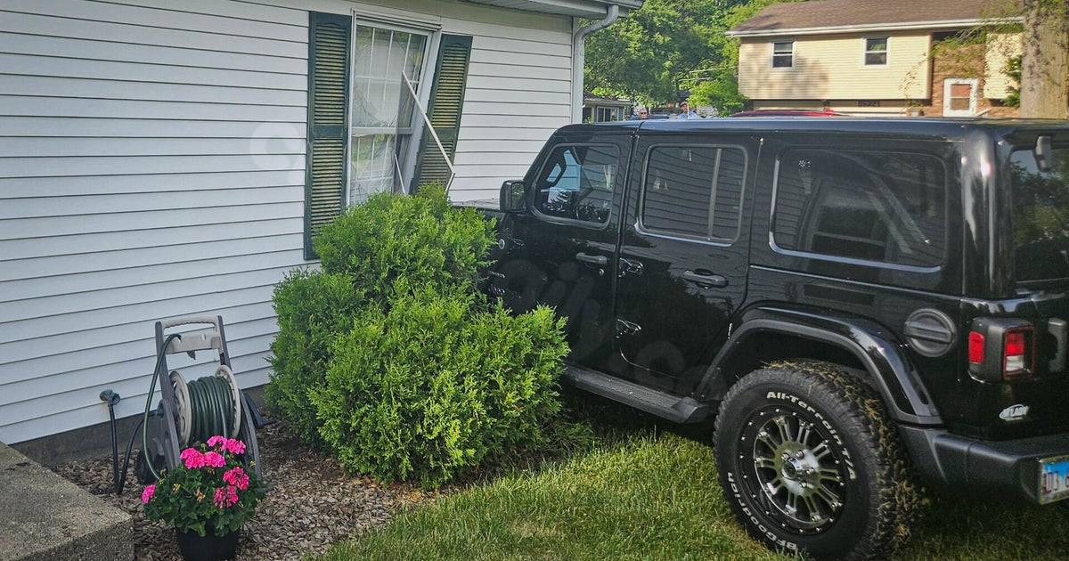 Car crashes into home in unincorporated Cary, Illinois, with 3 people inside