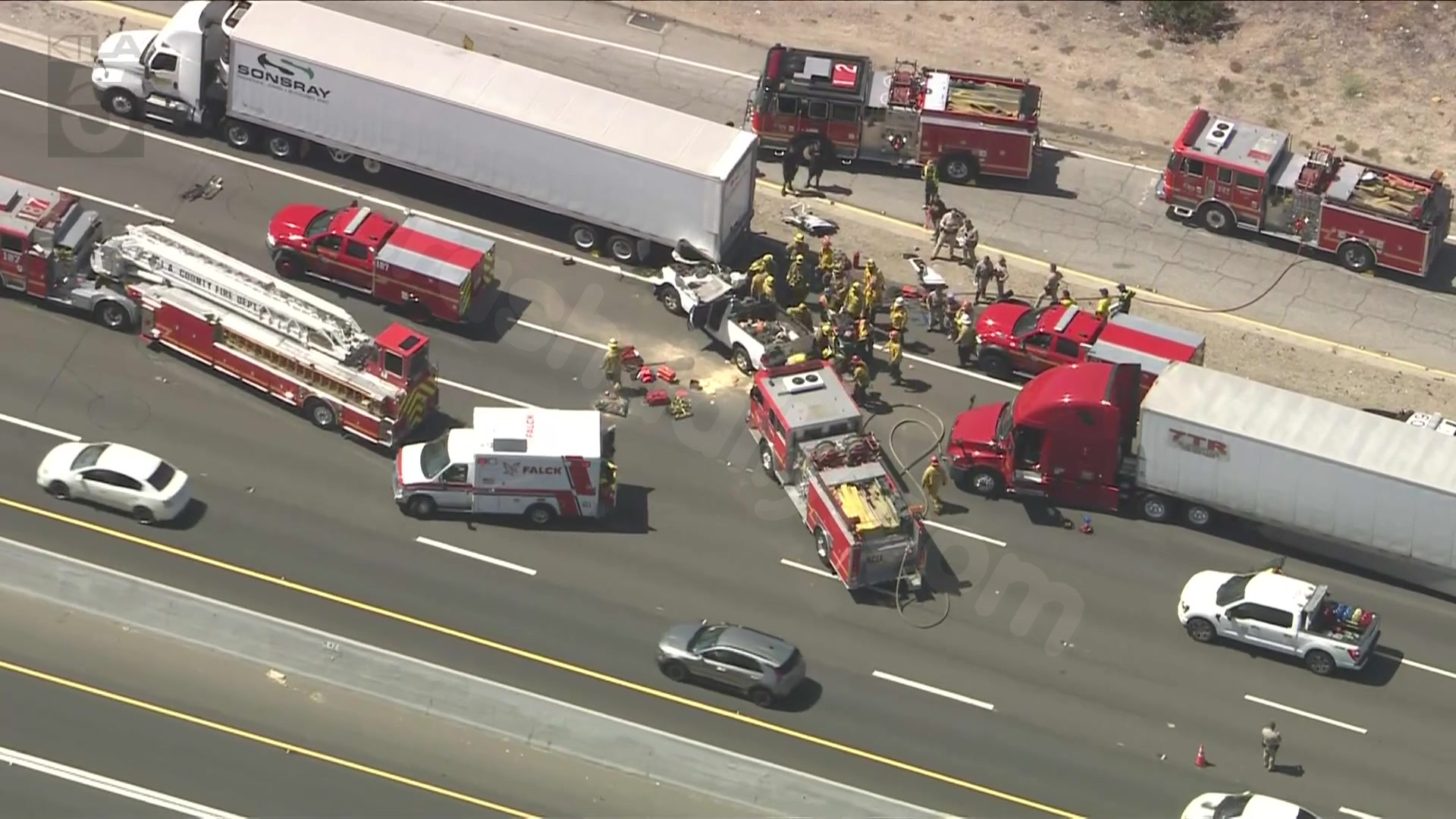 Driver rescued after vehicle rear ends semi truck on 10 Freeway in San Dimas