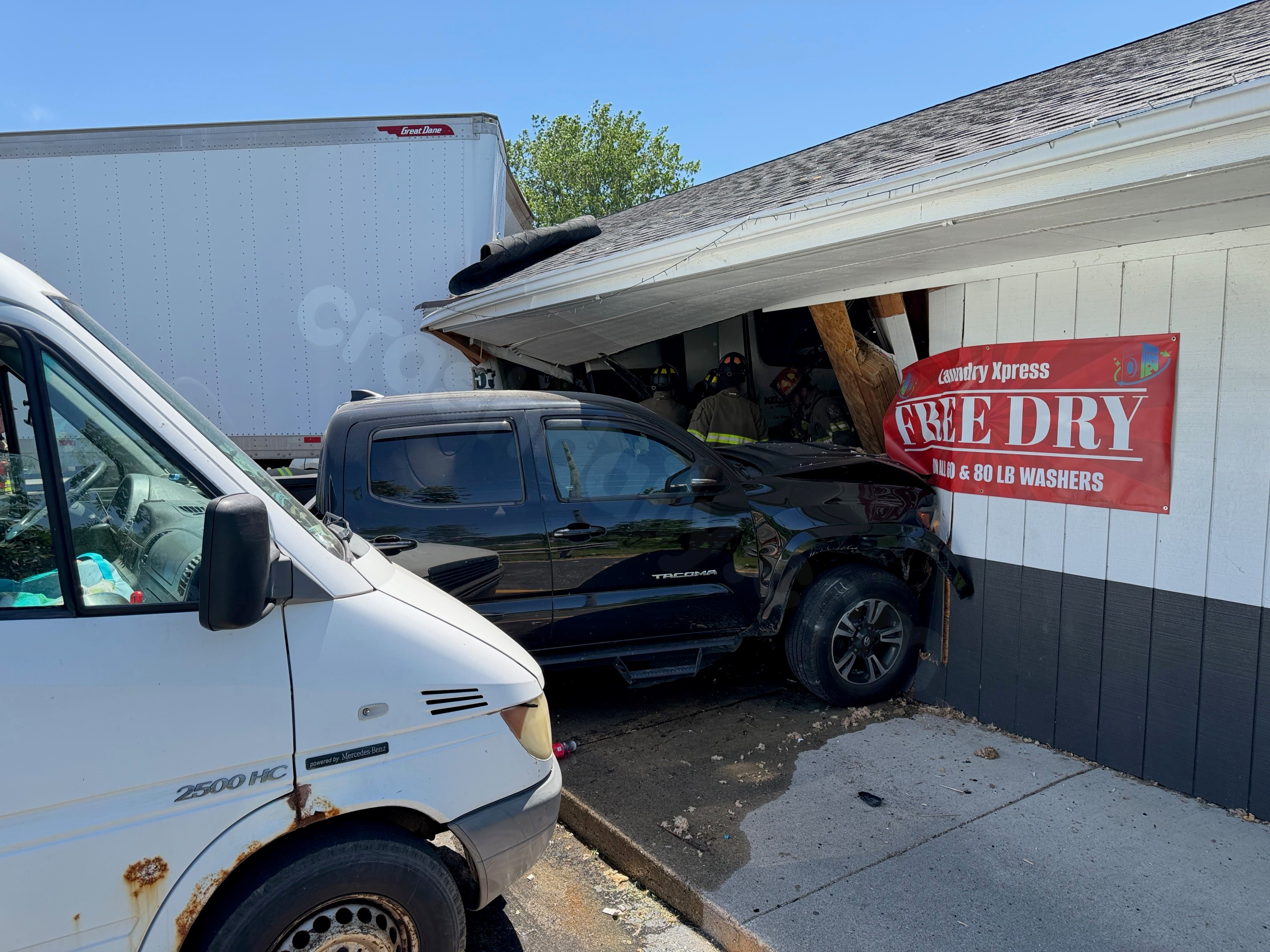 Six people hurt after semi crashes into laundromat on West Jefferson