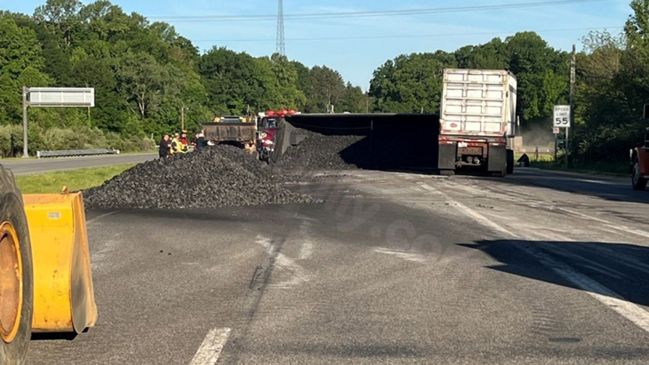 Man in critical condition after coal carrying semi overturns
