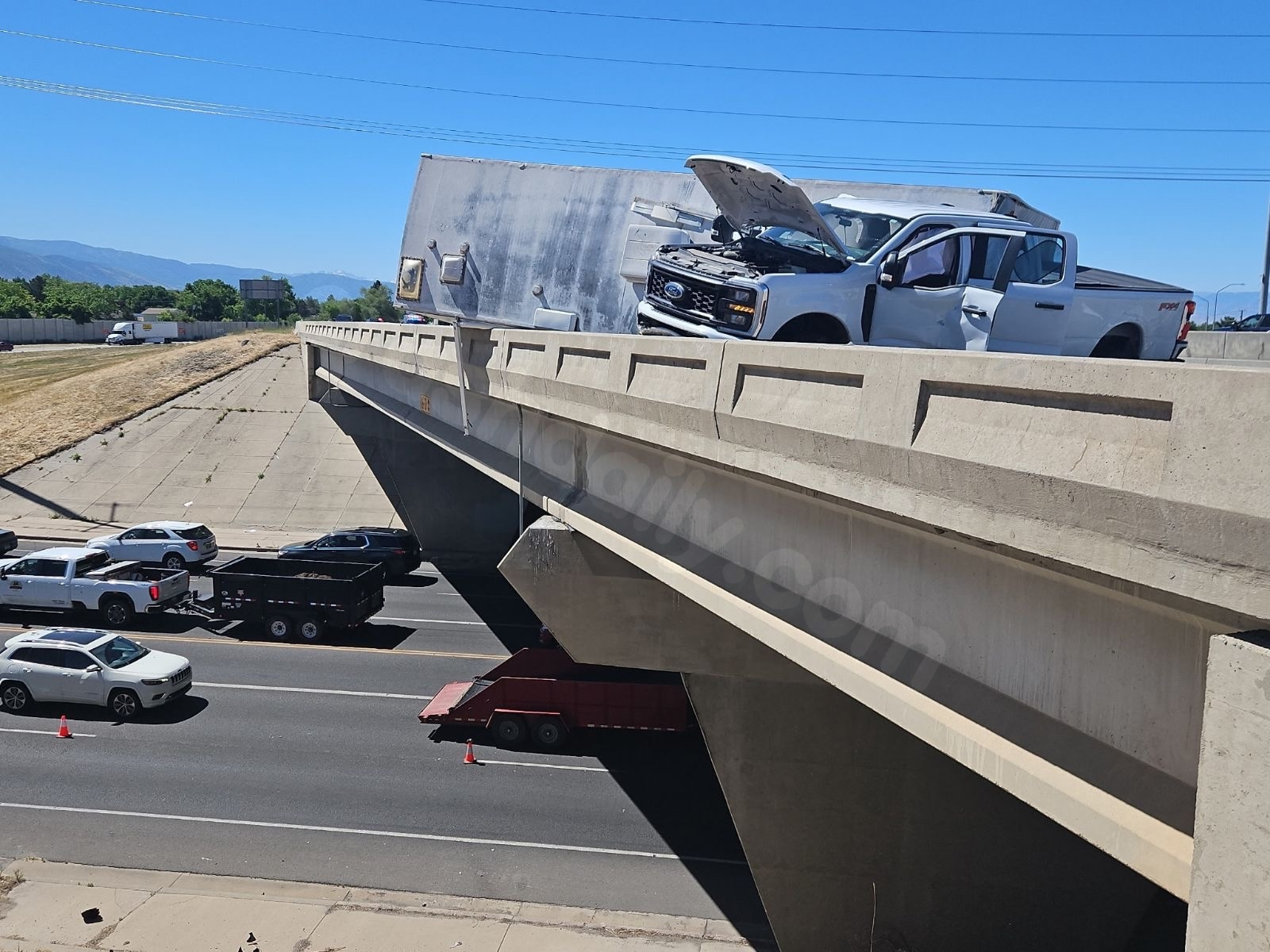 TRAFFIC ALERT: Two-vehicle crash leaves trailer hanging off I-15 overpass in Kaysville