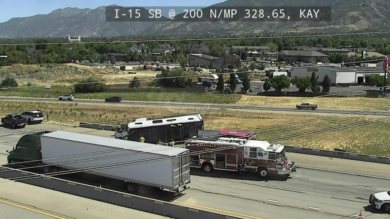 Trailer hangs over I-15 overpass after rollover crash in Kaysville