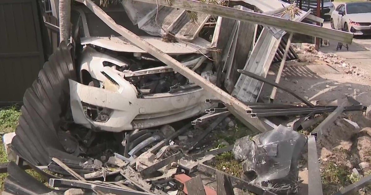 Car veers off road and crashes into a northwest Miami-Dade yard, nearly injuring multiple people