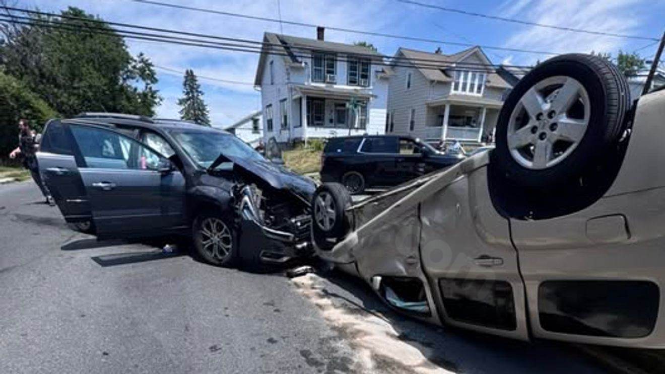 8 injured after vehicle flips over in crash