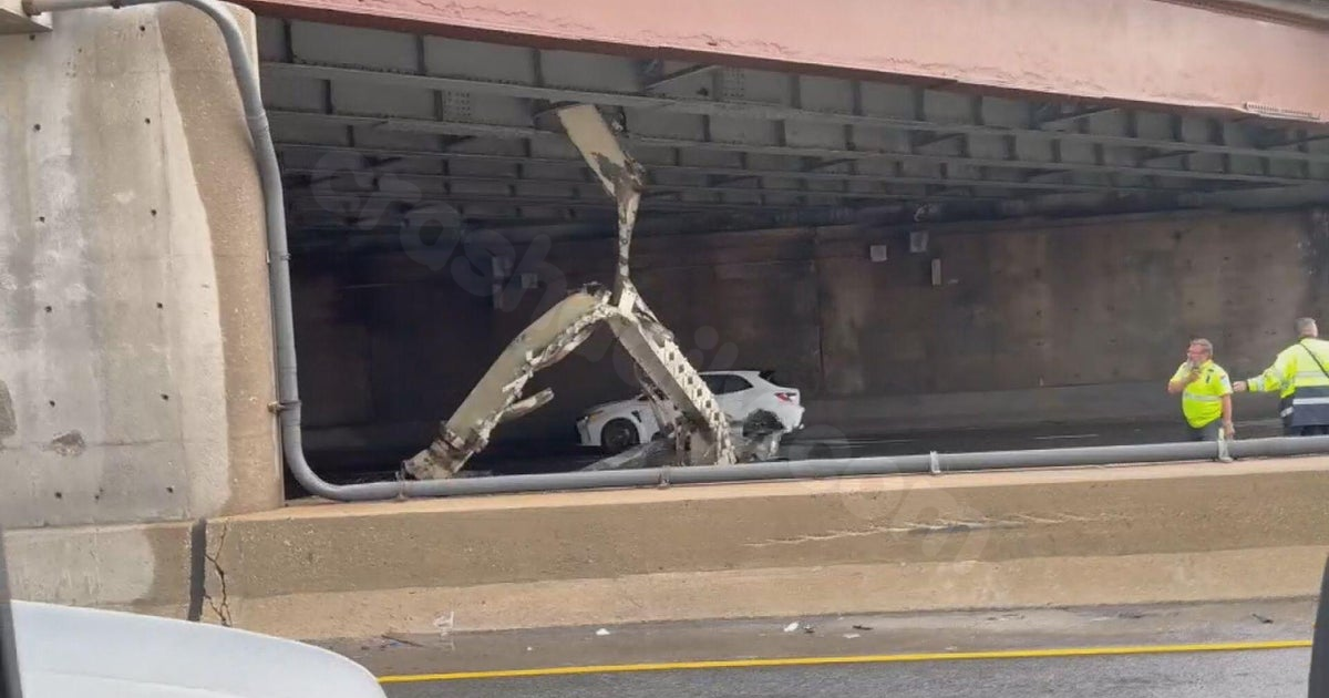 Inbound Kennedy Expressway lanes partially blocked near Grand Avenue by hanging metal
