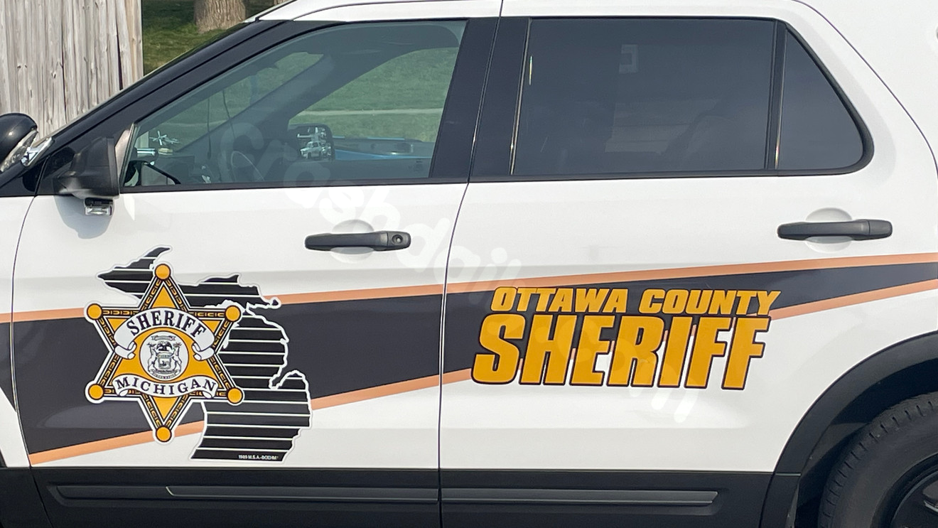 Injuries, road closure after crash between motorcycle and car in Georgetown Township