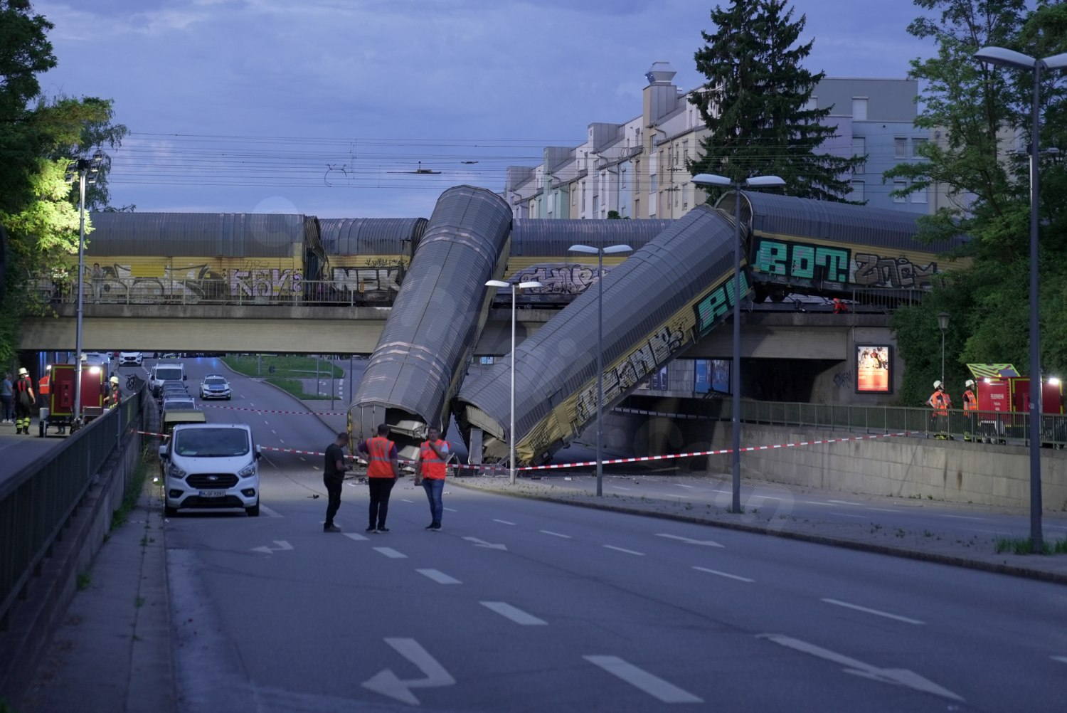 One dead after freight trains collide and crash off bridge in Munich