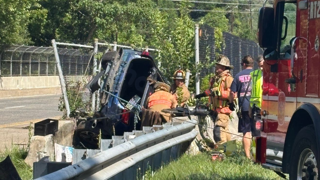 Car left hanging off edge of highway bridge after crash in Maryland