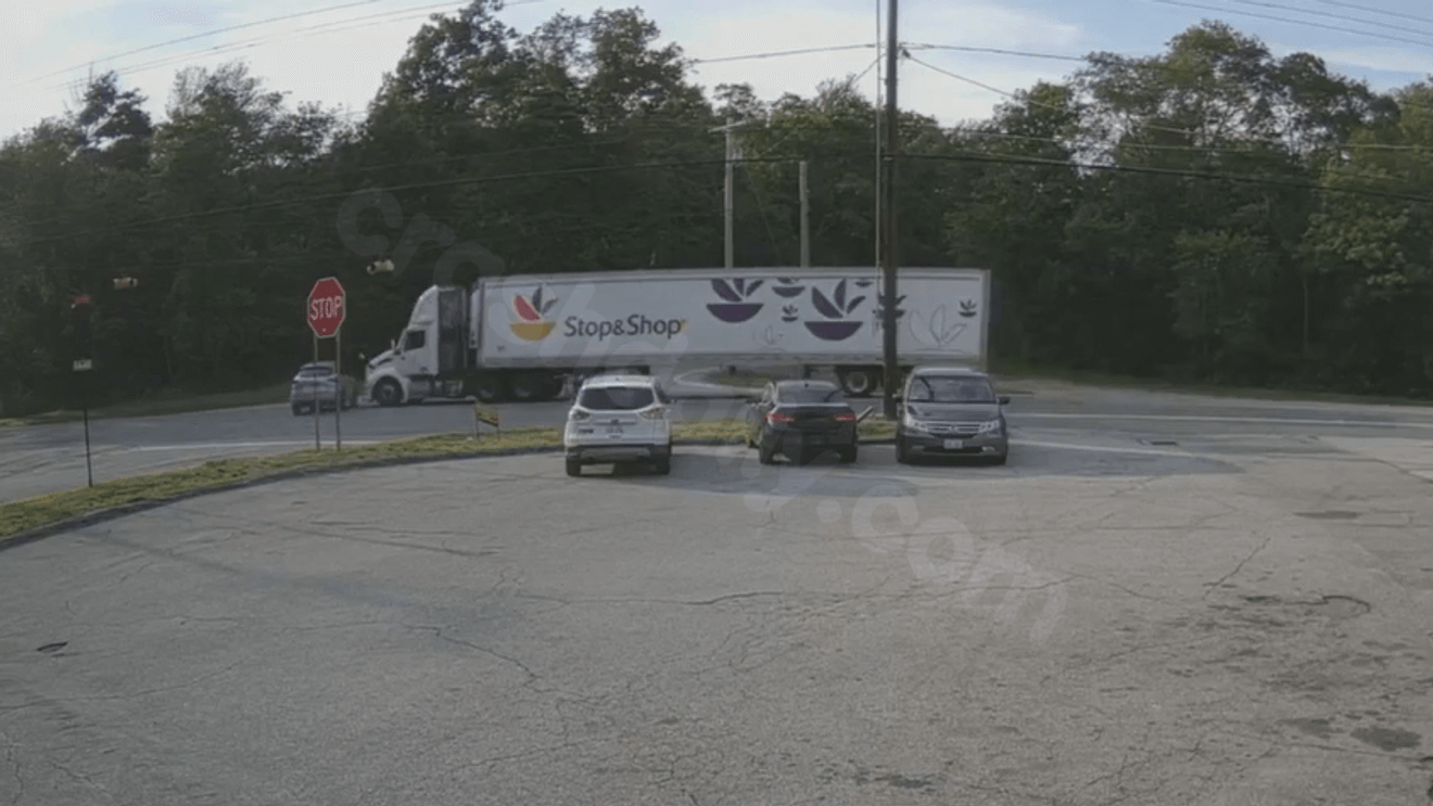 Car, tractor-trailer collide at Route 101 intersection in Foster