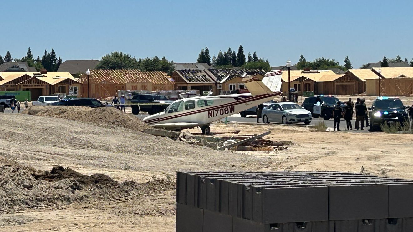 Crash-landed plane rests in field by Kings Estates Homes in Kingsburg