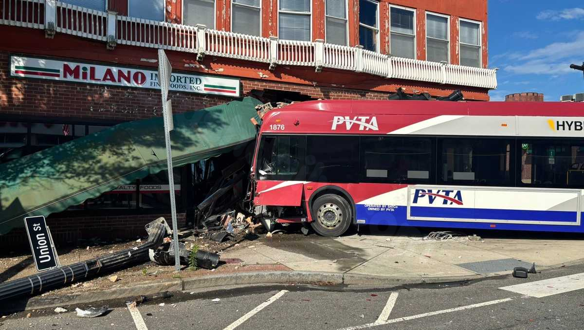 3 injured after bus crashes into car, storefront in Western Mass.