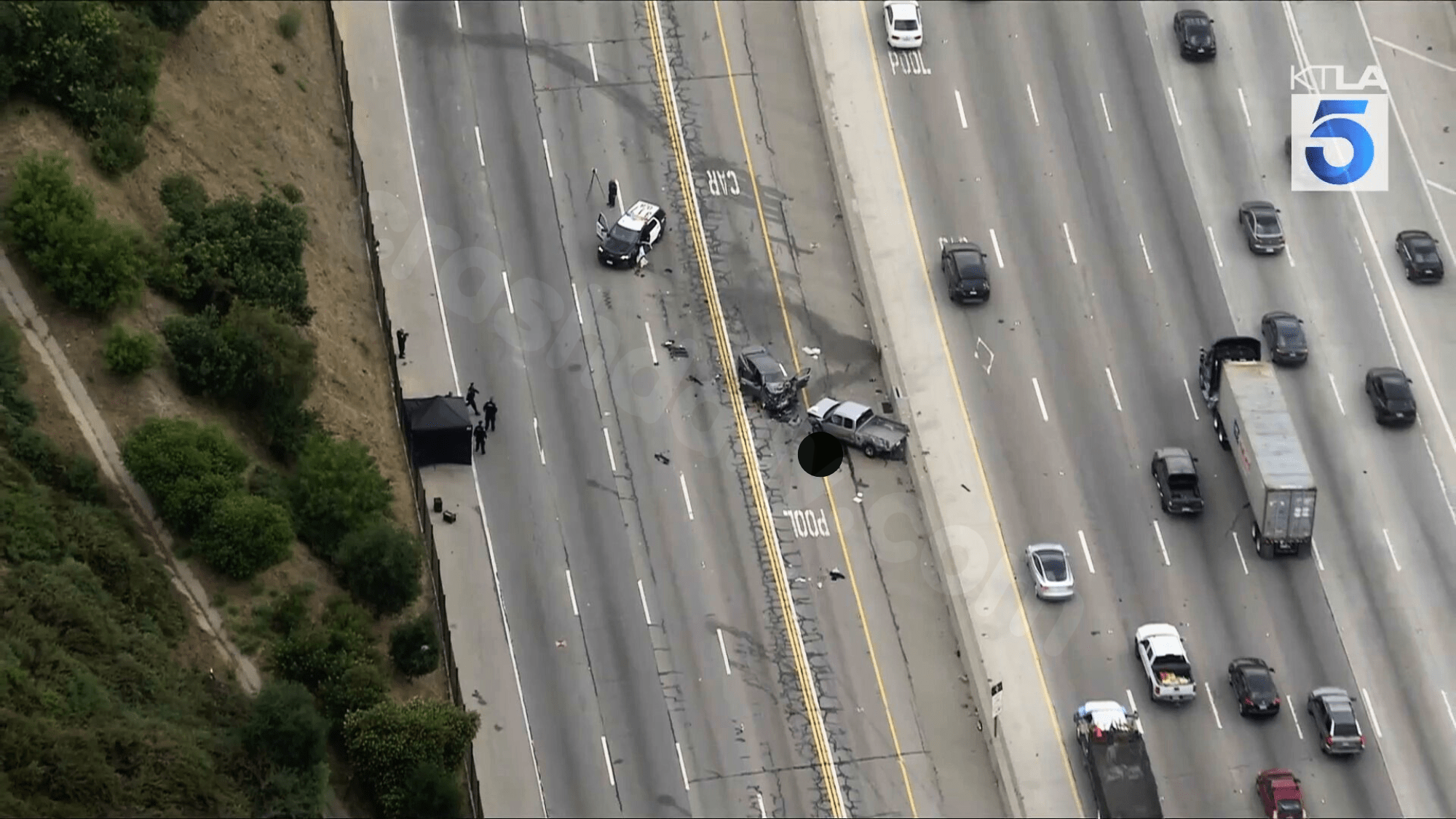 Arrest made, murder charges filed in 405 Fwy crash that killed LAPD officer