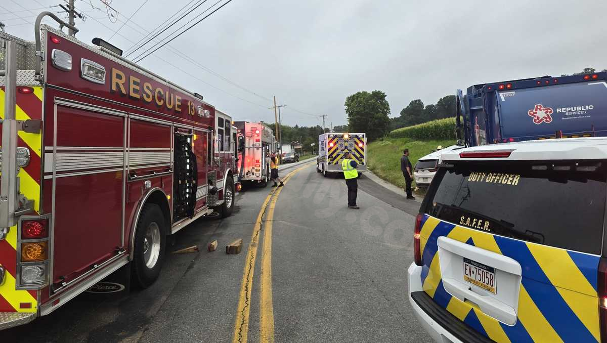 2 injured after garbage truck, SUV collide, fire officials say