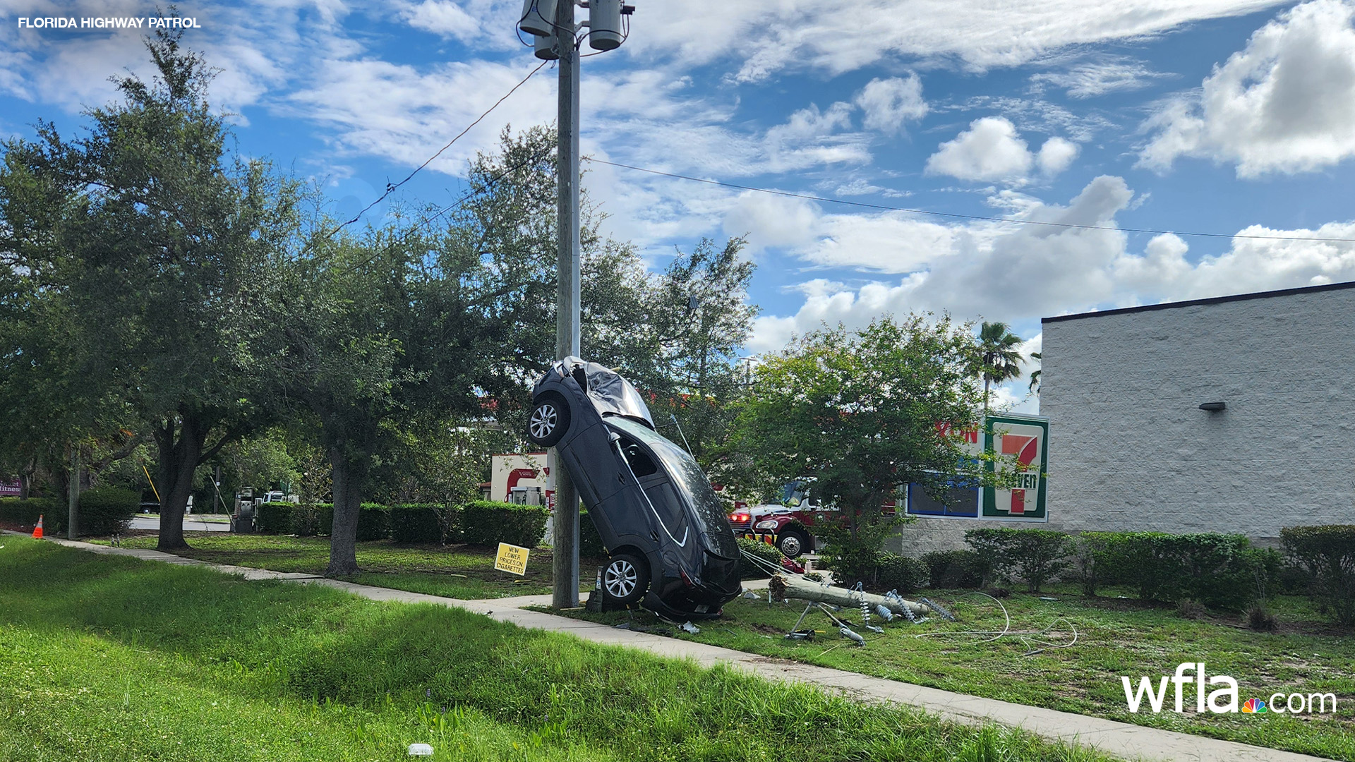 Driver arrested after car lands on its back wheels, propped against utility pole in Holiday crash