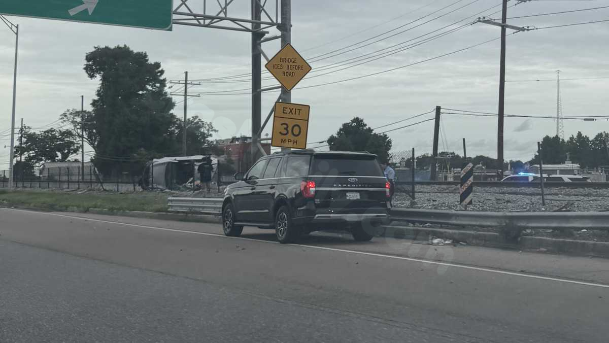 New Orleans driver hospitalized after car crashes, overturns on train tracks