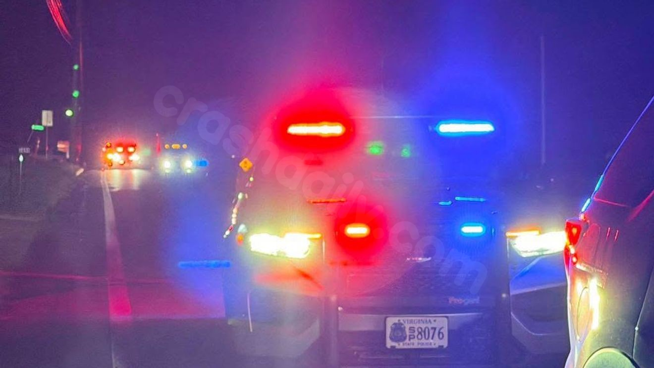 Overturned vehicle crash damages utility pole on South Amherst Highway