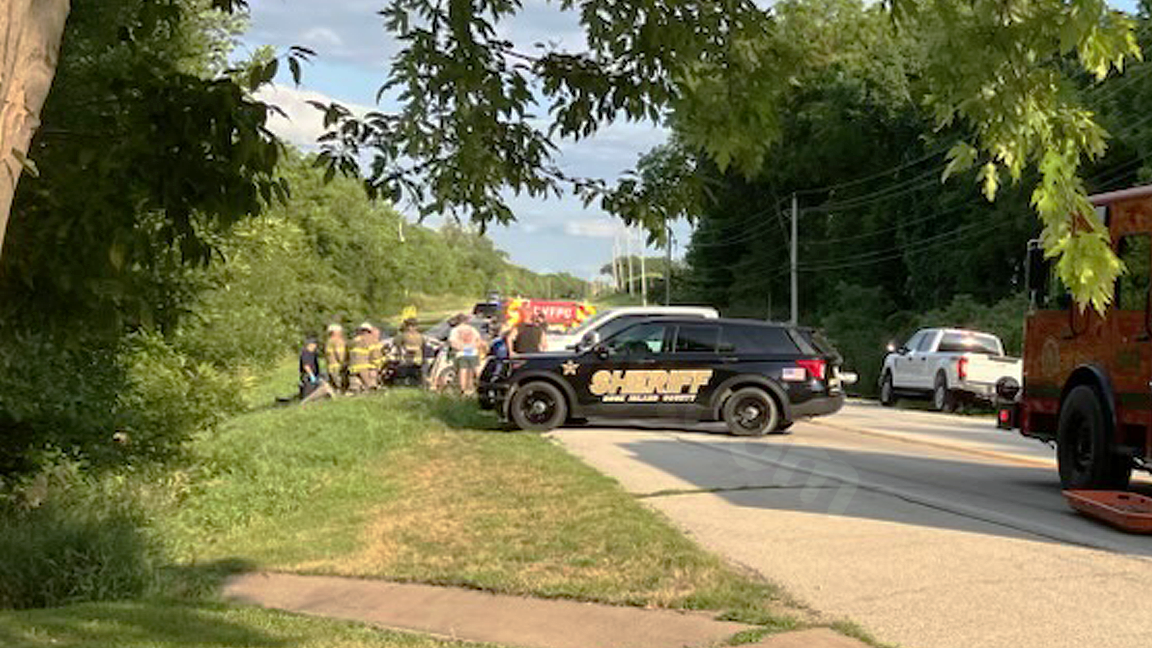Emergency responders extricate man from car at crash site on U. S. Route 150